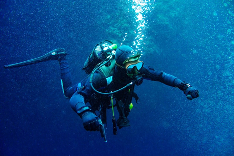 divers have to carry a lot of bulky equipment