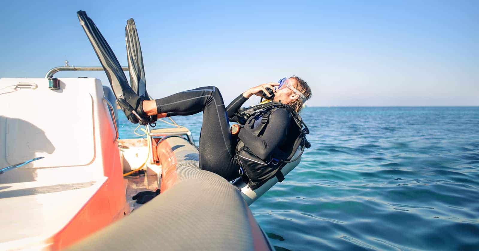 why do scuba divers dive backwards